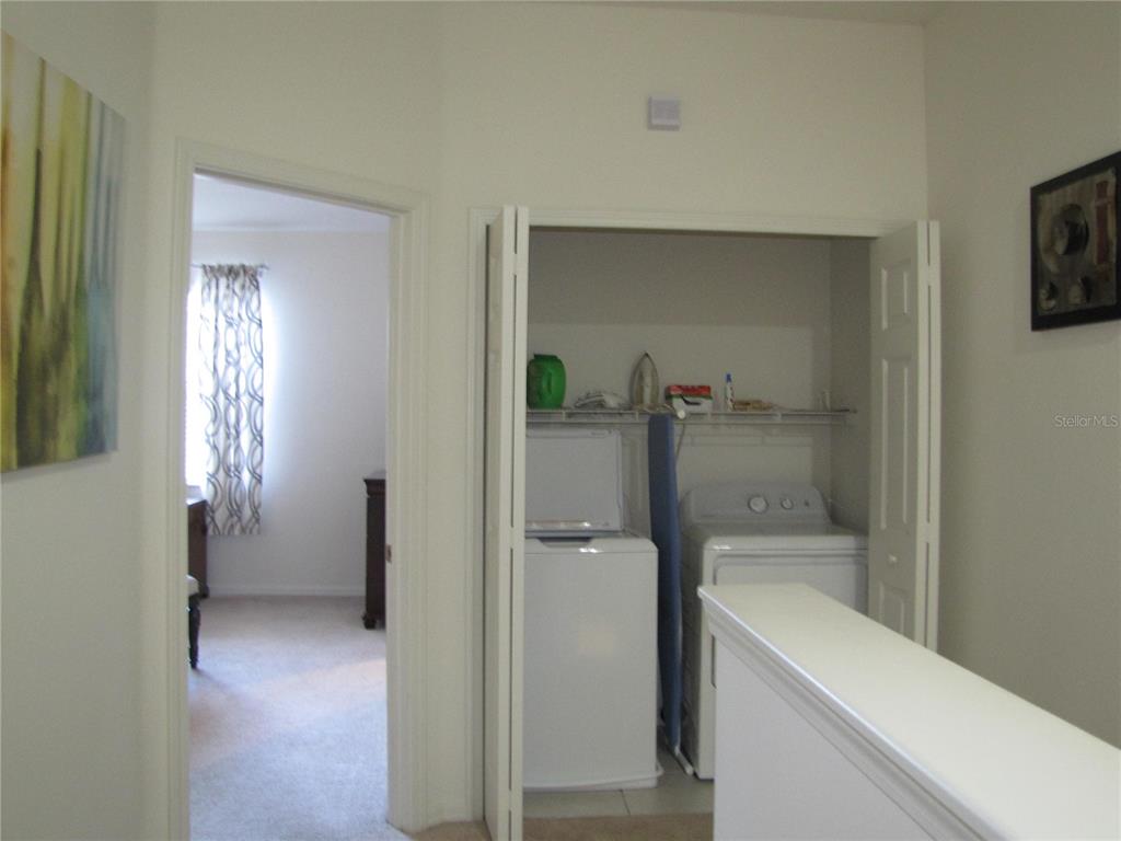 3461 Parkridge Circle, Unit 18104 Sarasota, FL 34243 - Photo 15 of 35 a bathroom with a bathtub and a toilet