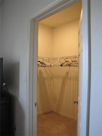 a bathroom with a sink mirror and a shower