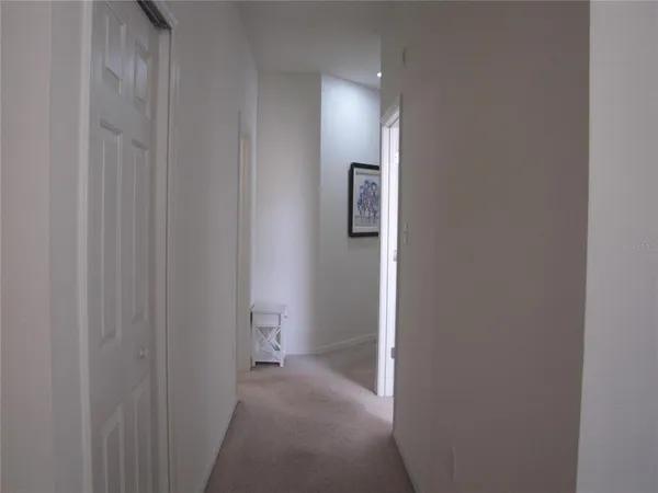 a room with a bed and a lamp on table