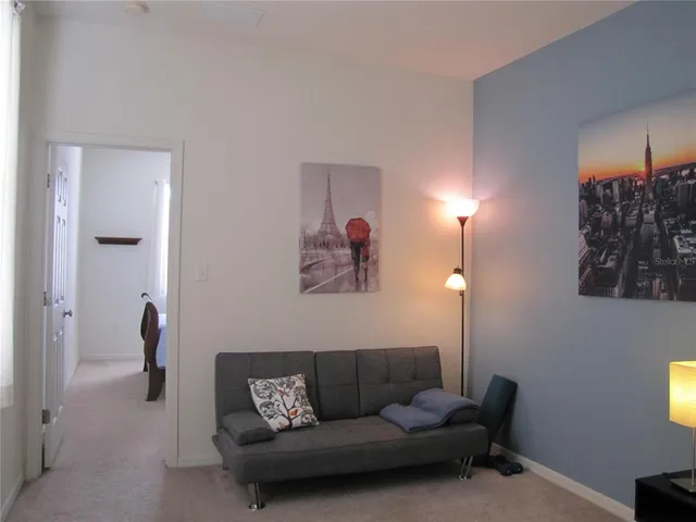 a view of a hallway with wooden shelves