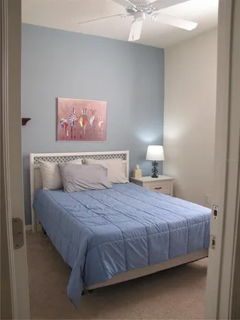 a bedroom with a bed and a closet