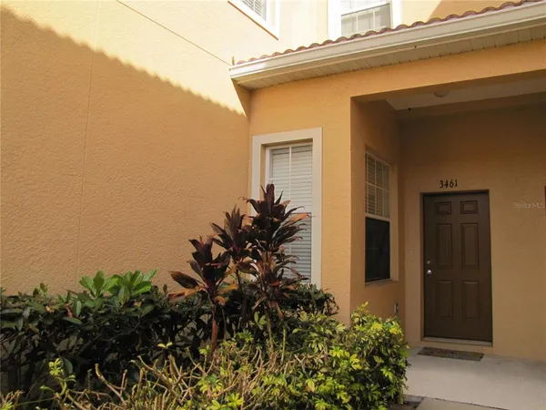 front view of a house with a small yard