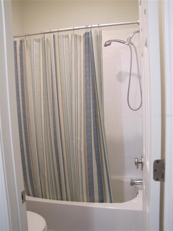 3461 Parkridge Circle, Unit 18104 Sarasota, FL 34243 - Photo 31 of 35 a bathroom with a shower