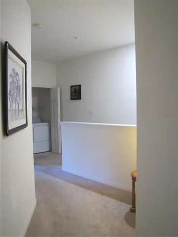 a view of a lake with houses in the back