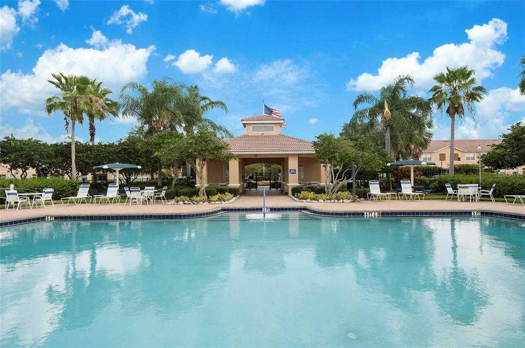 3461 Parkridge Circle, Unit 18104 Sarasota, FL 34243 - Photo 34 of 35 a view of a swimming pool with outdoor seating