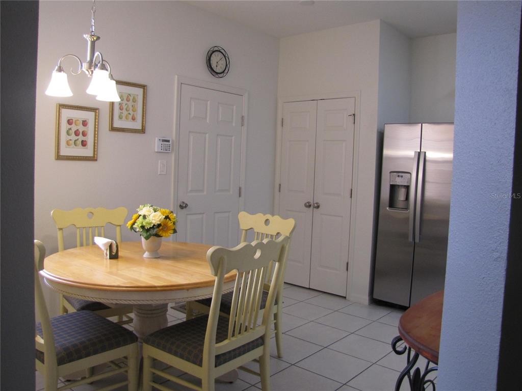 3461 Parkridge Circle, Unit 18104 Sarasota, FL 34243 - Photo 6 of 35 a view of a dining room with furniture