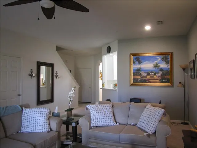a living room with furniture and a window
