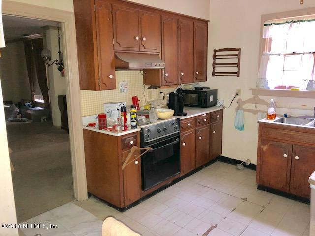 11626 Brady Road Jacksonville, FL 32223 - Photo 29 of 39 a kitchen with a cabinets and window