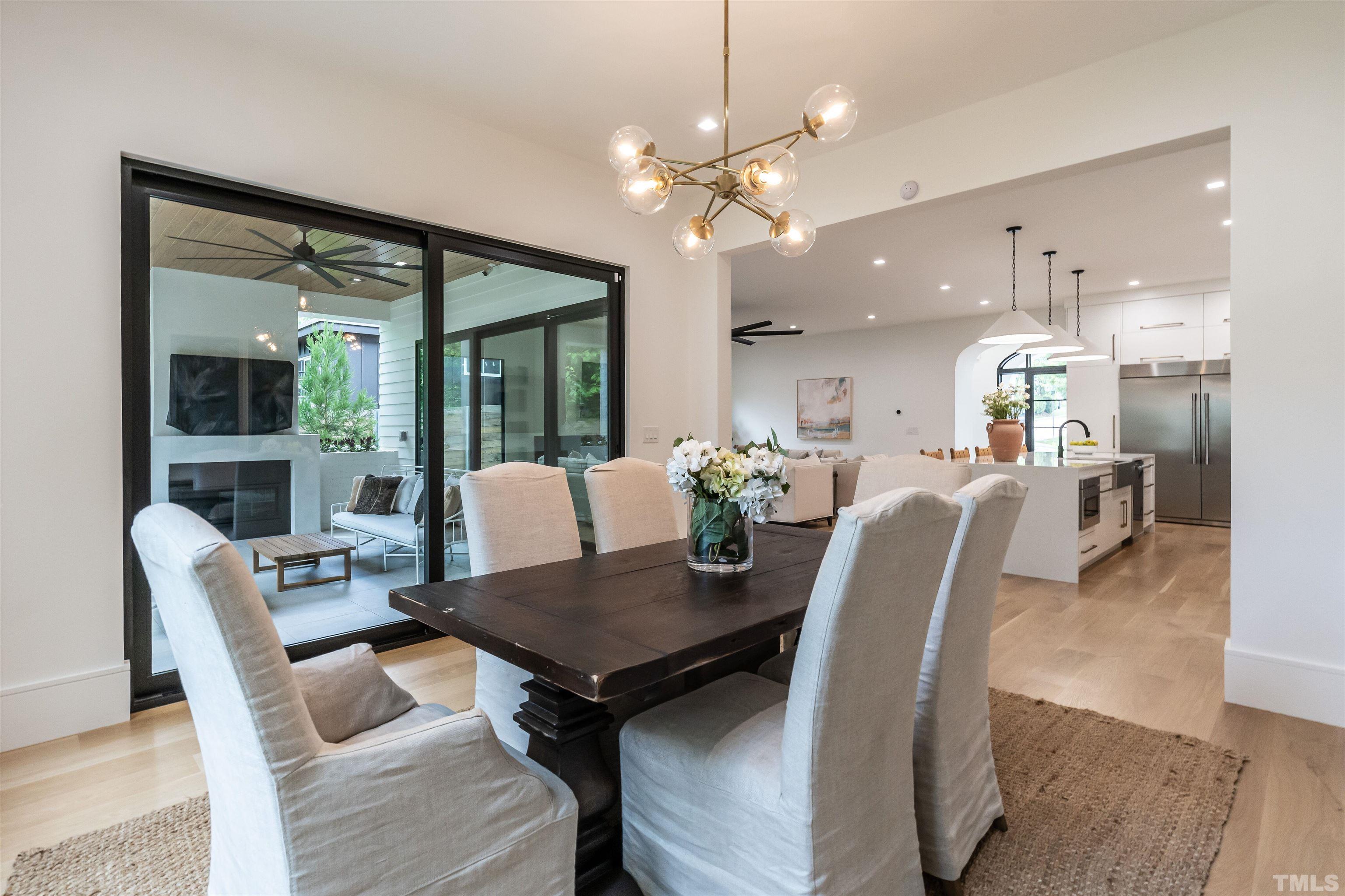 628 Sasser Street Raleigh, NC 27604 - Photo 20 of 45 a view of a dining room with furniture and wooden floor