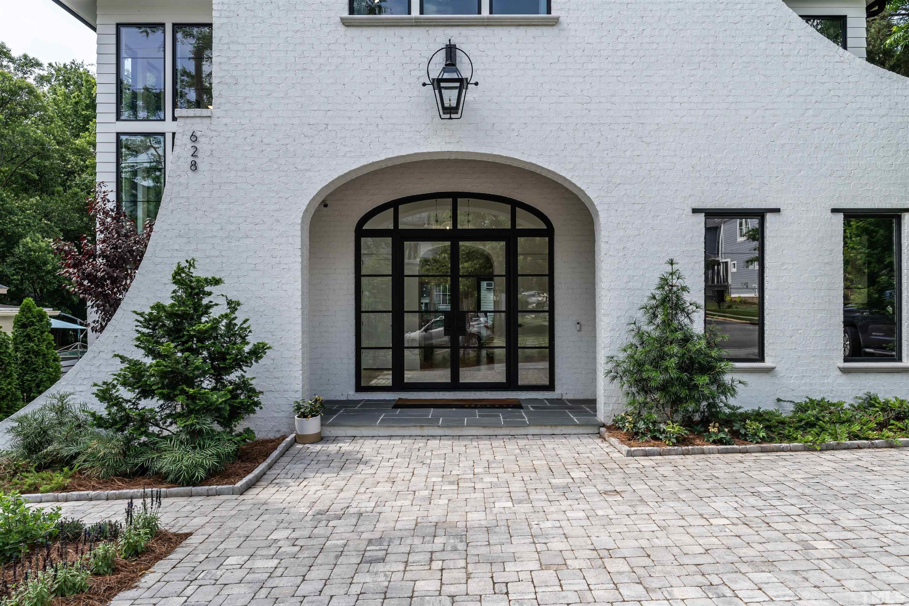 628 Sasser Street Raleigh, NC 27604 - Photo 2 of 45 a front view of a house with a garden