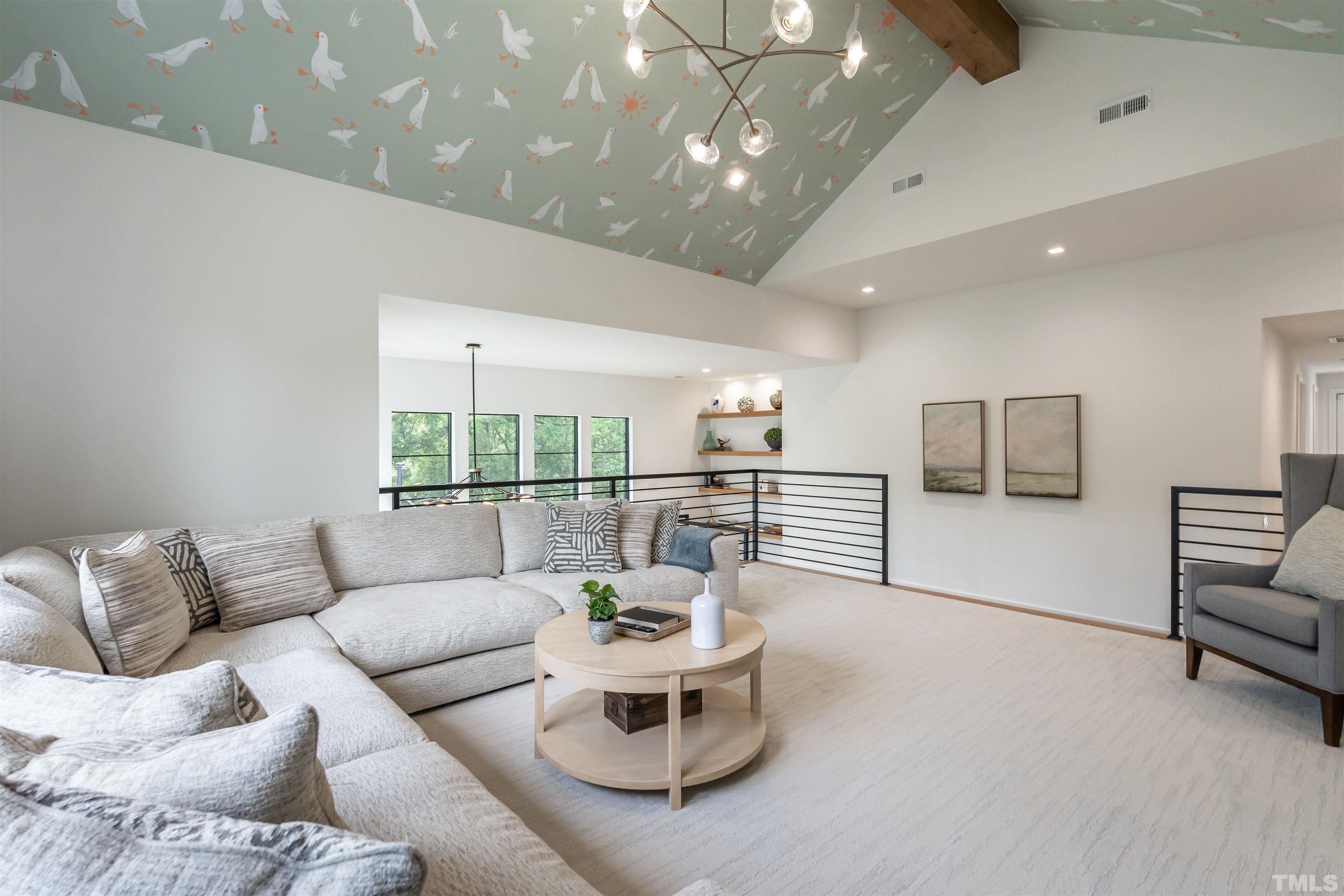 628 Sasser Street Raleigh, NC 27604 - Photo 25 of 45 a living room with furniture and a large window