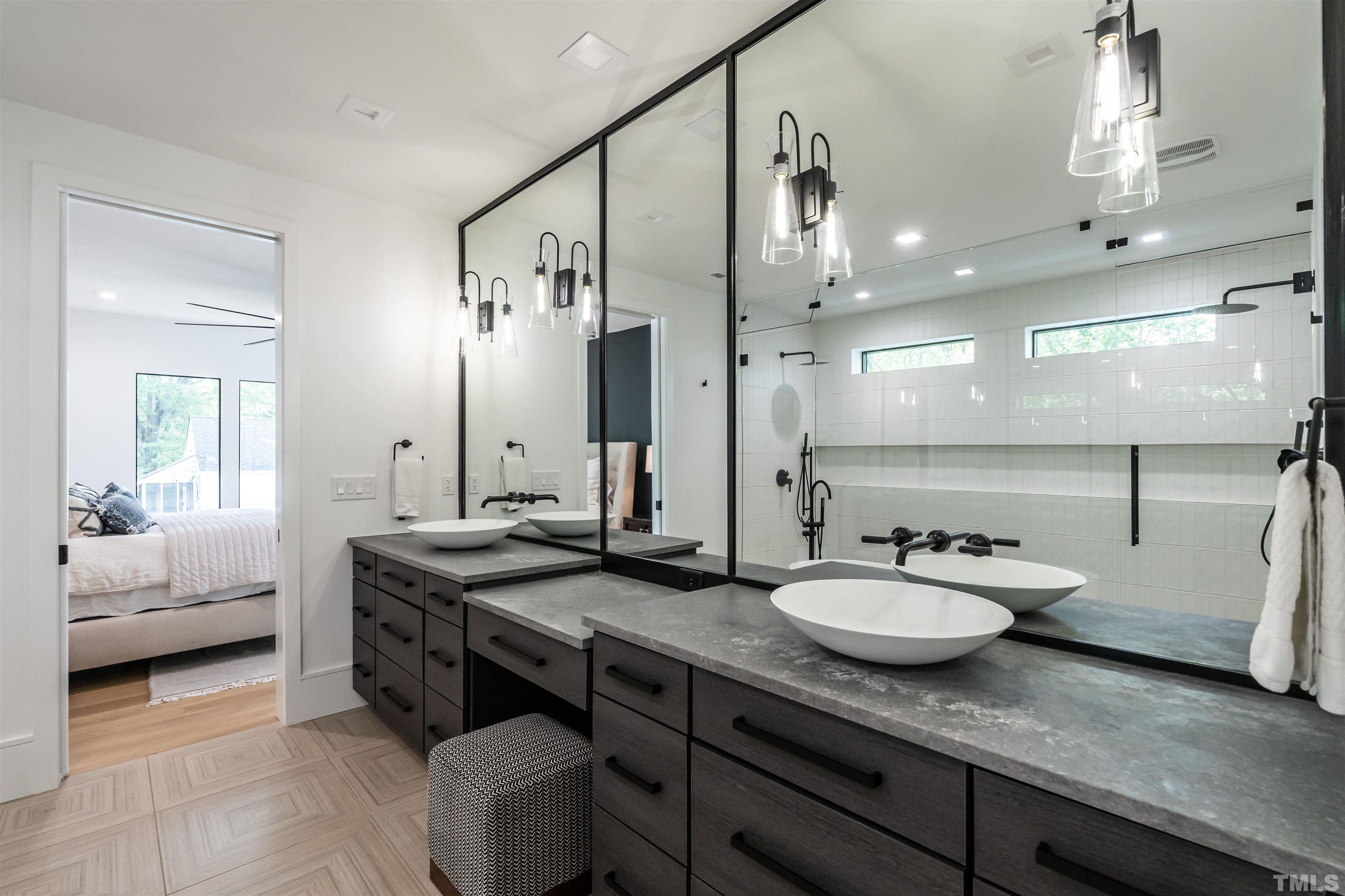 628 Sasser Street Raleigh, NC 27604 - Photo 30 of 45 a bathroom with a sink double vanity granite and a mirror