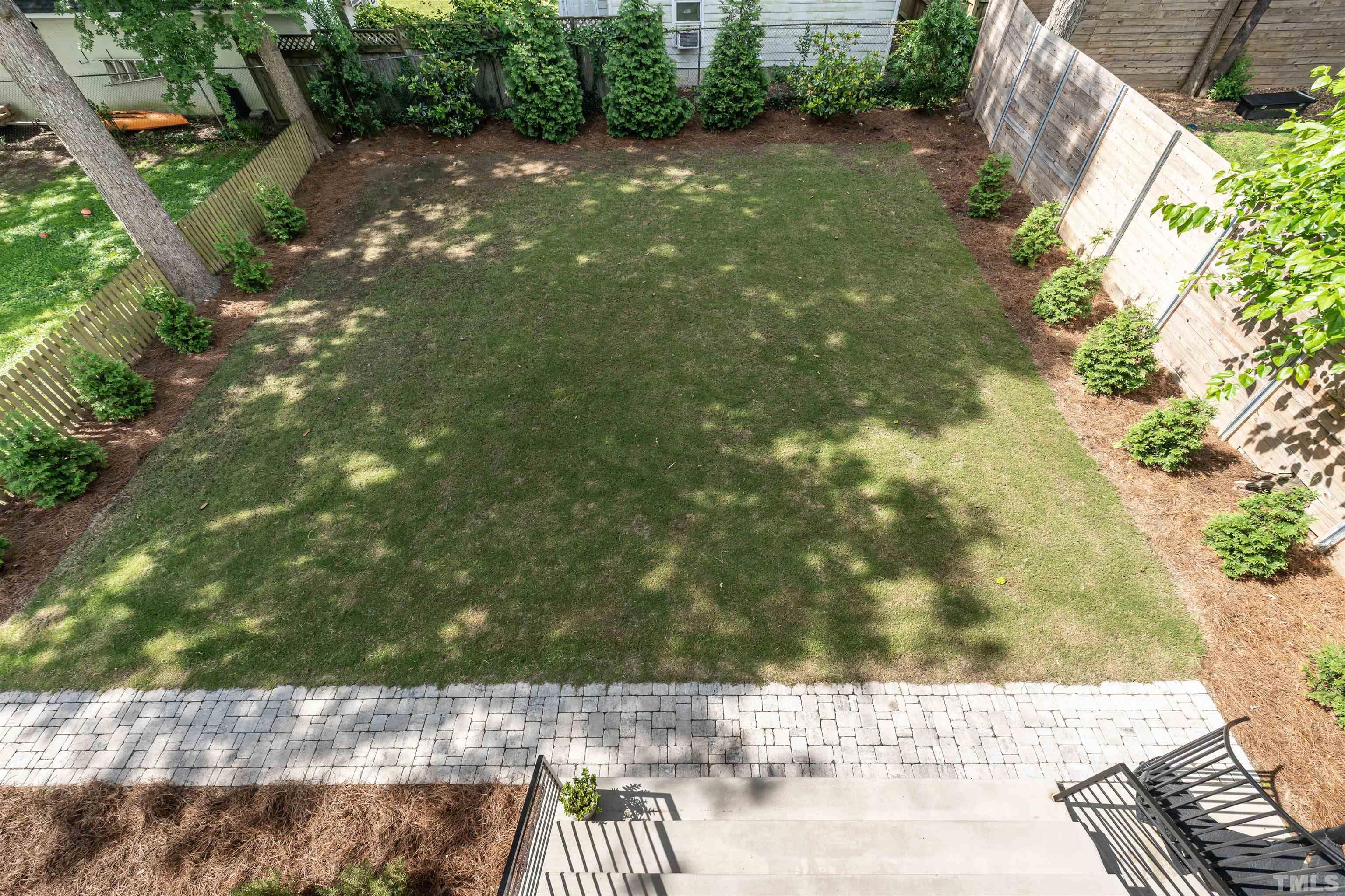 628 Sasser Street Raleigh, NC 27604 - Photo 41 of 45 a view of a yard with plants and large trees