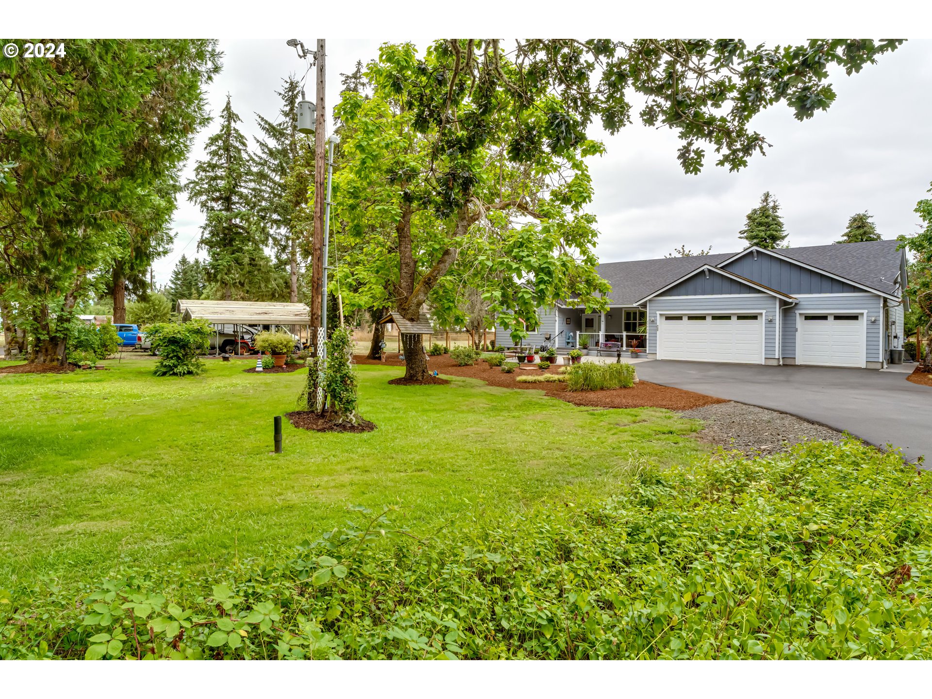 33900 Row River Road Cottage Grove, OR 97424 - Photo 3 of 48 a view of a house with a yard