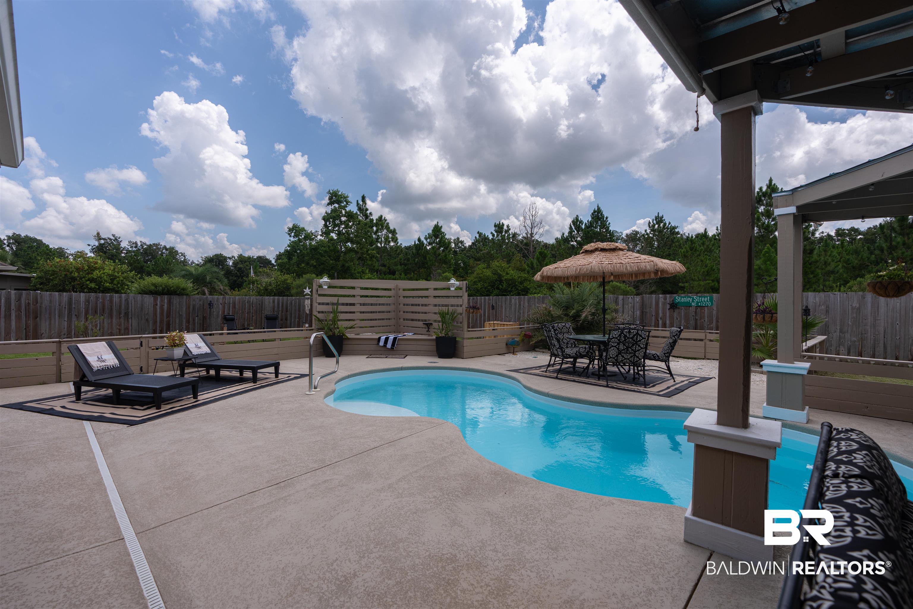 3168 Bellingrath Drive Foley, AL 36535 - Photo 23 of 36 View of swimming pool featuring a patio