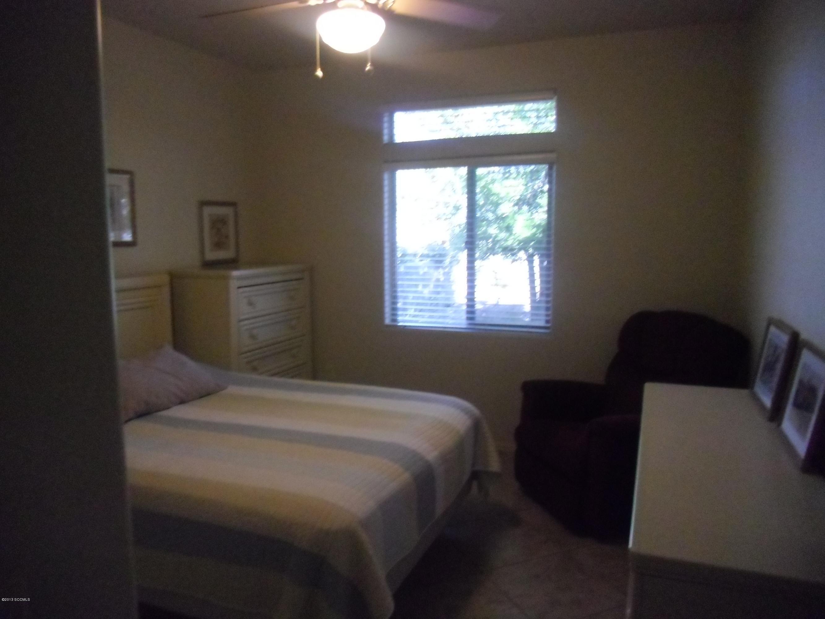 942 Via Puebla Rio Rico, AZ 85648 - Photo 5 of 73 a bedroom with a bed and window