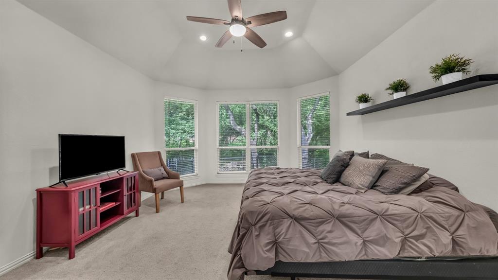 203 Mockingbird Lane Aledo, TX 76008 - Photo 24 of 37 Vaulted ceiling featuring a ceiling fan with integrated lighting