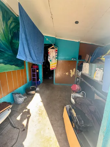 a view of a room with furniture and a potted plant