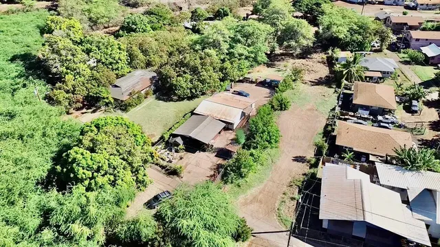 an aerial view of house with yard