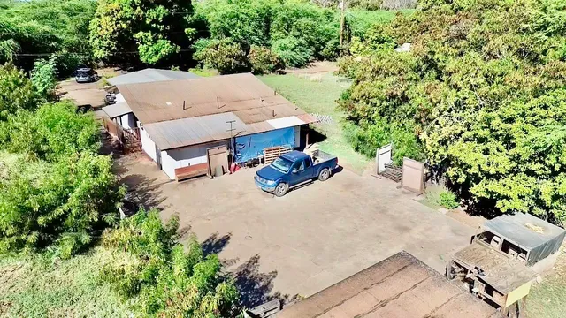an aerial view of a house with outdoor space