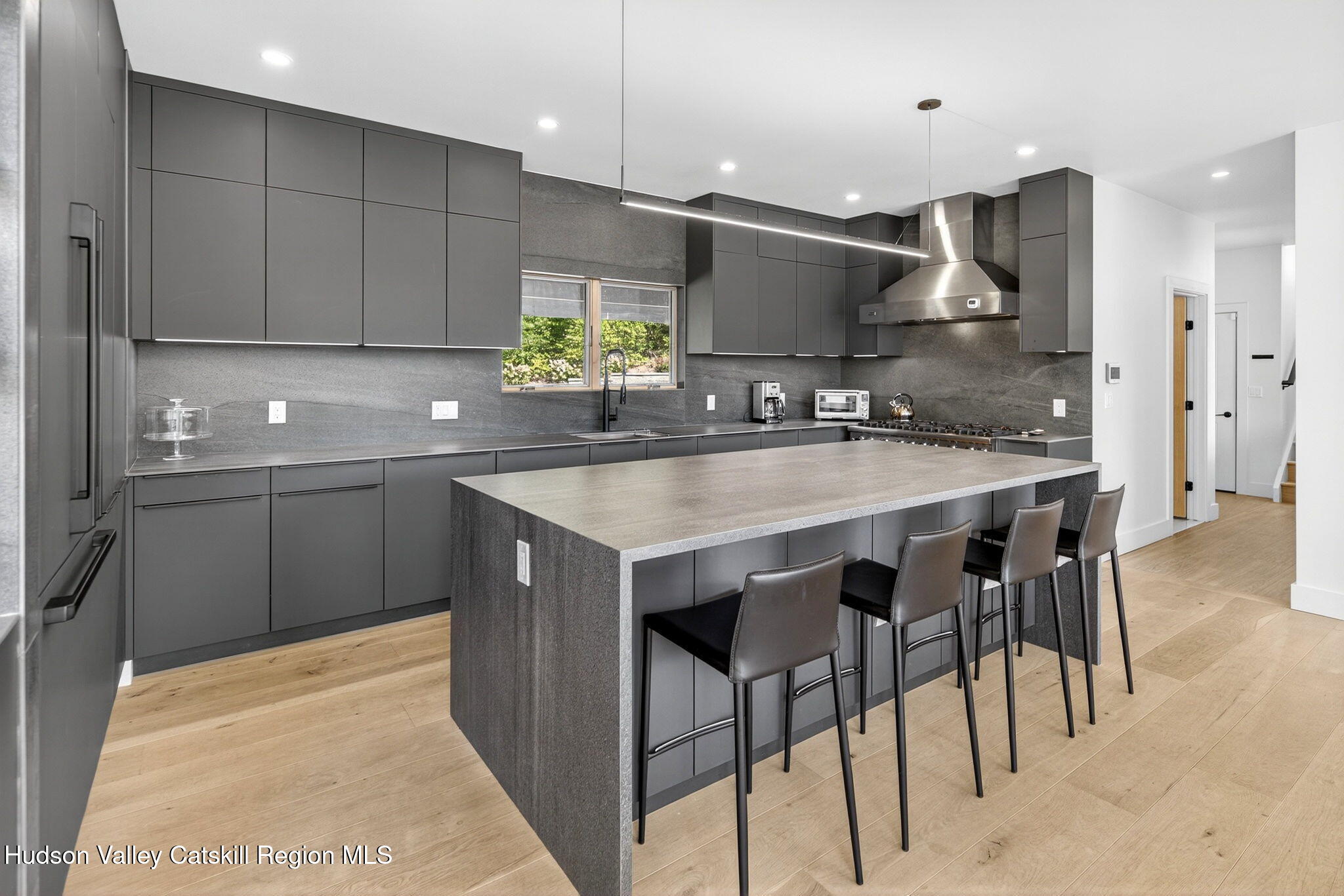 110 Old Road Windham, NY 12496 - Photo 17 of 66 a kitchen with kitchen island granite countertop a sink and refrigerator