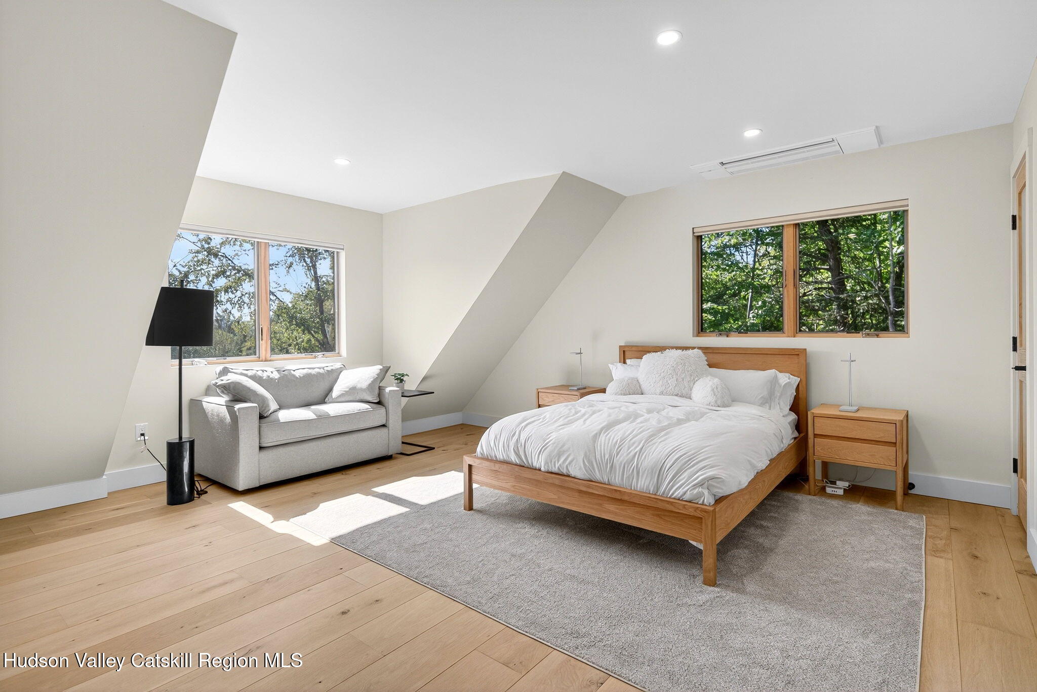 110 Old Road Windham, NY 12496 - Photo 19 of 66 a spacious bedroom with a bed and a couch