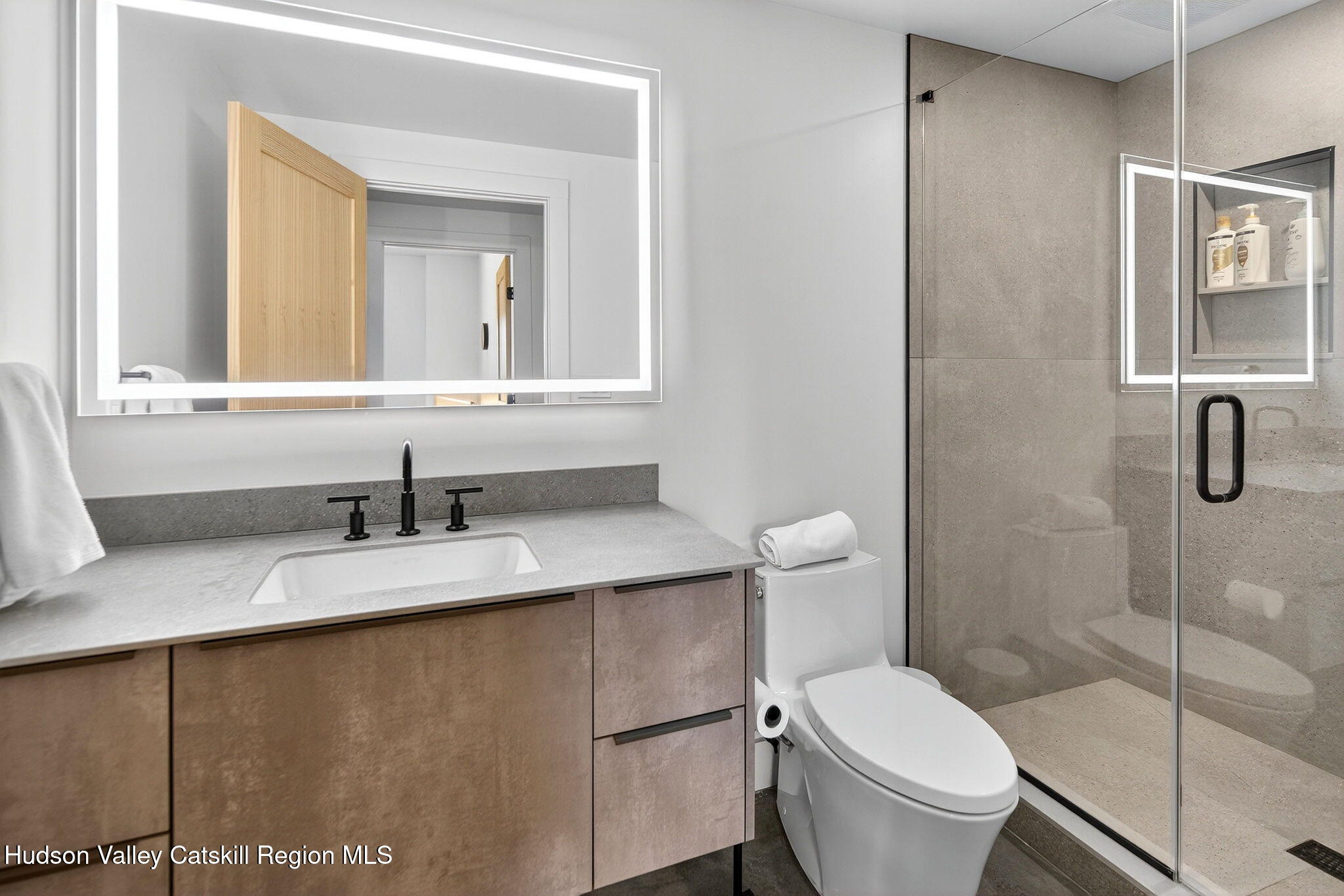 110 Old Road Windham, NY 12496 - Photo 23 of 66 a bathroom with a granite countertop sink toilet and mirror