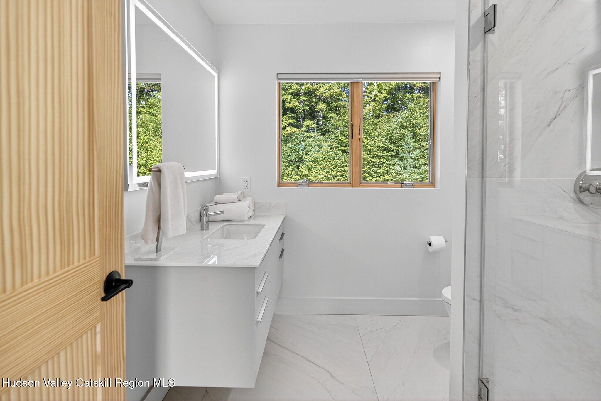 110 Old Road Windham, NY 12496 - Photo 34 of 66 a bathroom with a sink toilet and a window