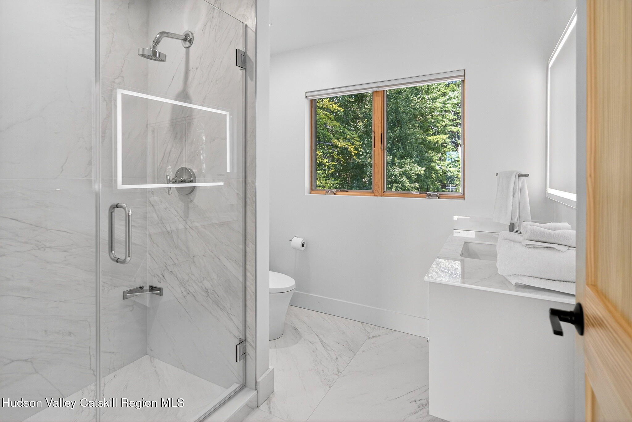110 Old Road Windham, NY 12496 - Photo 36 of 66 a bathroom with a granite countertop shower a toilet and a sink
