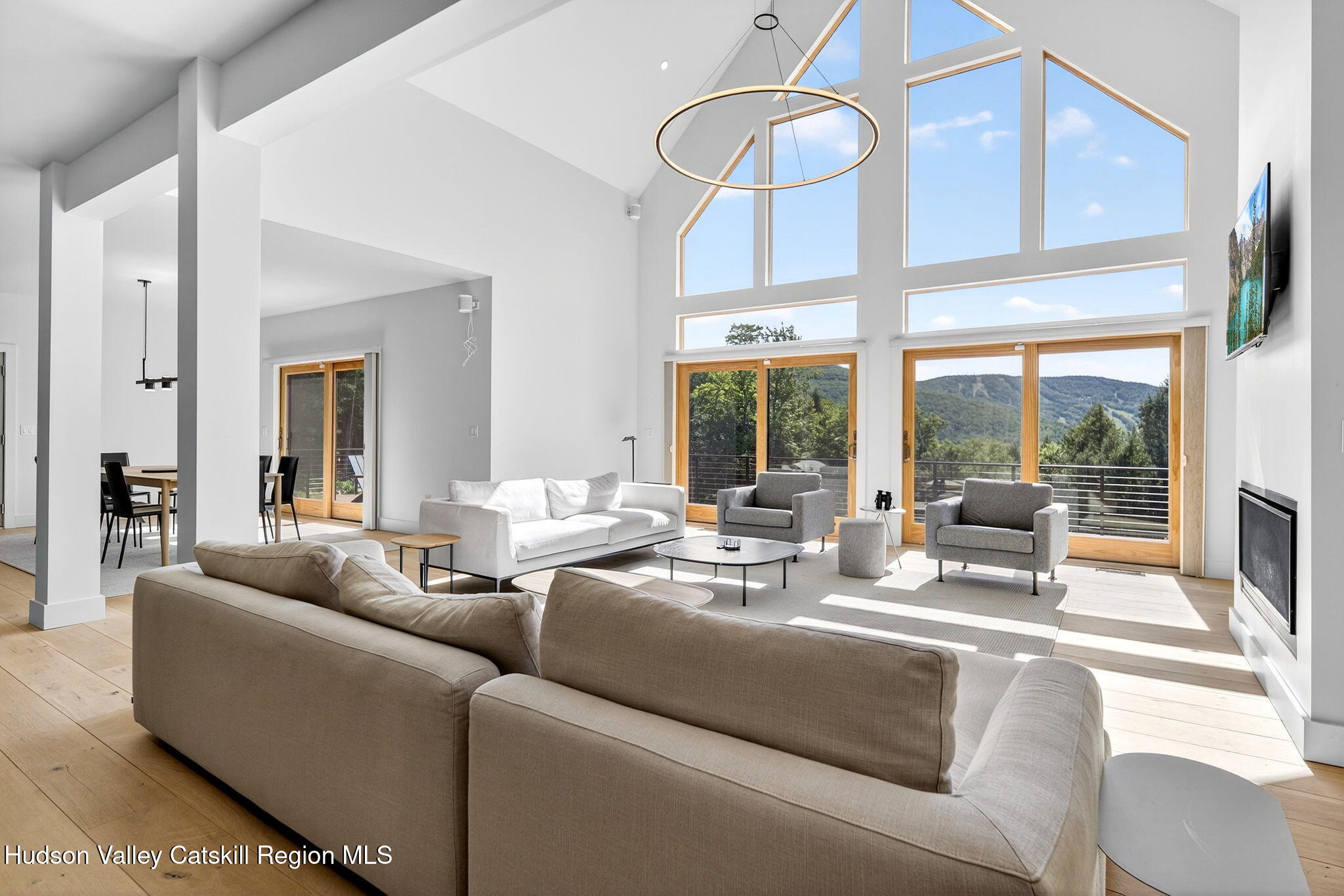 110 Old Road Windham, NY 12496 - Photo 6 of 66 a living room with furniture and large windows