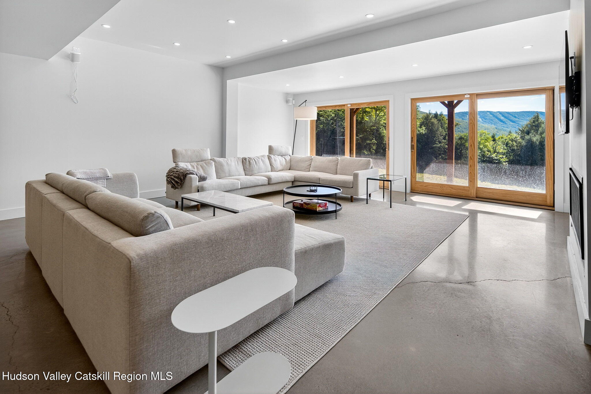110 Old Road Windham, NY 12496 - Photo 9 of 66 a living room with furniture and a large window