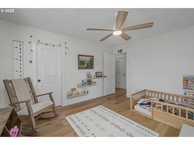 a bedroom with furniture and a window