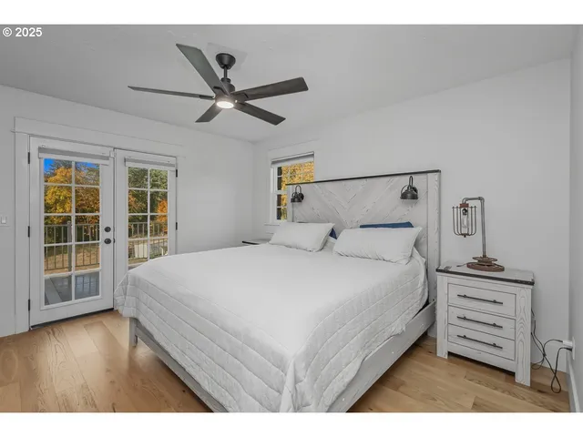 a large white bed in a white room