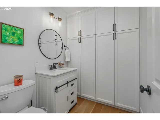 a bathroom with a sink a vanity and a mirror