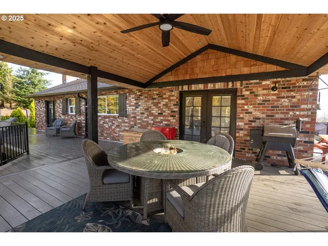a dining room with furniture and wooden floor
