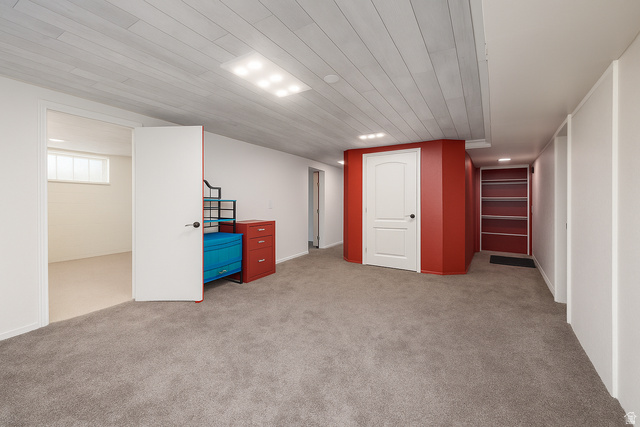 16535 South Redwood Road Riverton, UT 84065 - Photo 28 of 59 Grey carpet flooring, white plank ceiling, recessed lighting, white walls, and built-in shelving