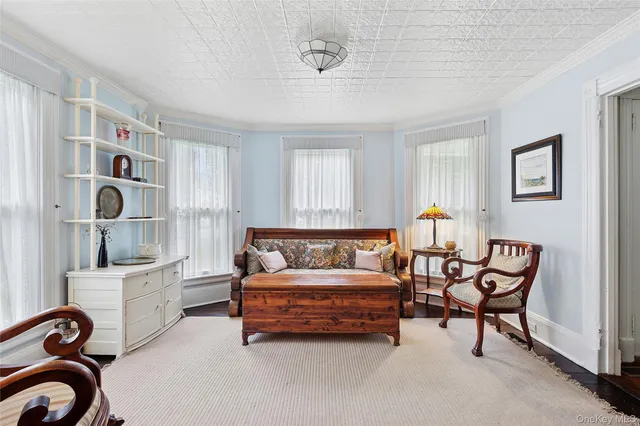 a bedroom with furniture and a window