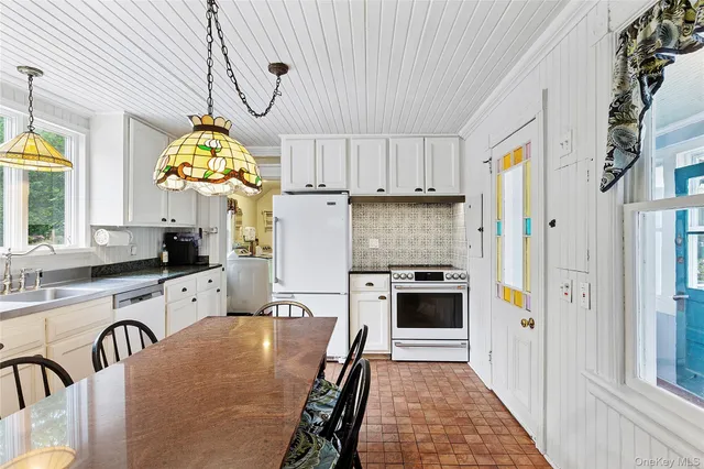 a kitchen with cabinets and a stove