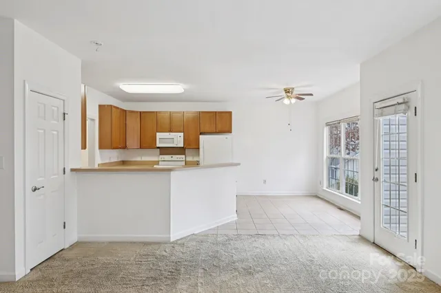 a view of kitchen with cabinets