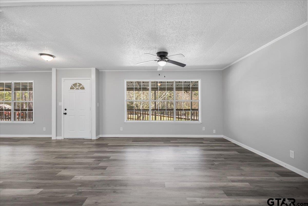 18607-c R 498 C R 498 Lindale, TX 75771 - Photo 12 of 41 a view of an empty room with a window and wooden floor