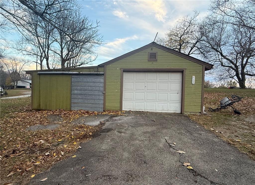 721 South 88th Road Carmichaels, PA 15320 - Photo 4 of 27 a front view of a house with a yard and garage