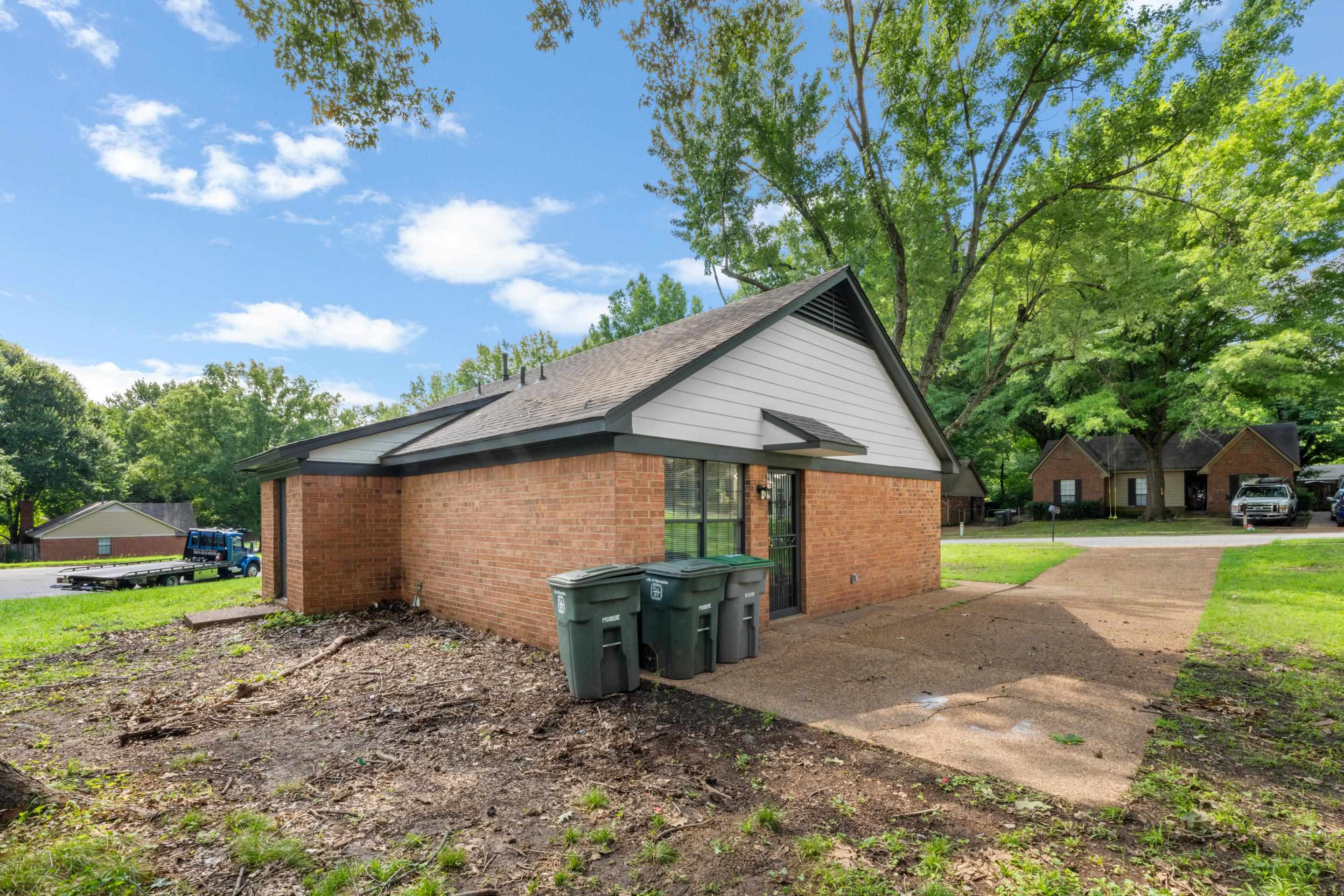 6400 Saginaw Road Memphis, TN 38134 - Photo 23 of 27 Durable brick construction, mature trees, and ample outdoor space create a comfortable setting with room to enjoy the outdoors year-round.