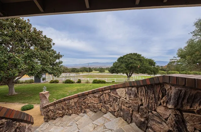 a view of a lake with houses in the back
