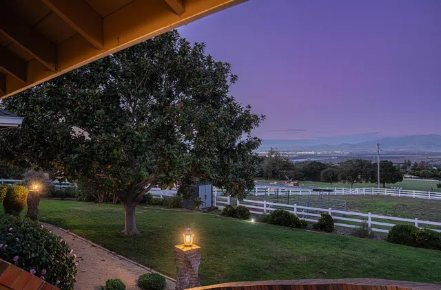 a view of a entryway with wooden floor and door