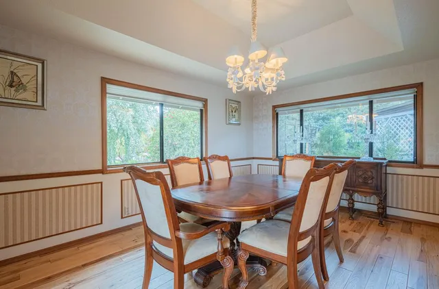 a view of a deck in front of house with a yard