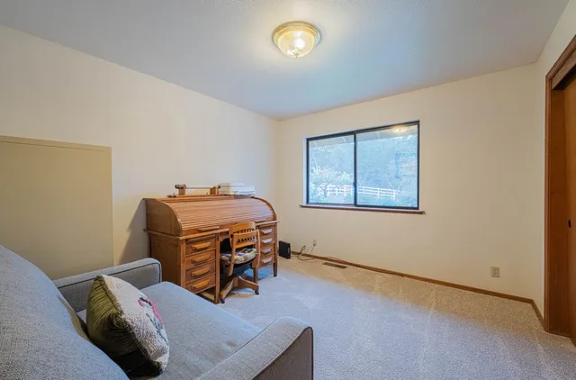 an aerial view of residential house with outdoor space and swimming pool