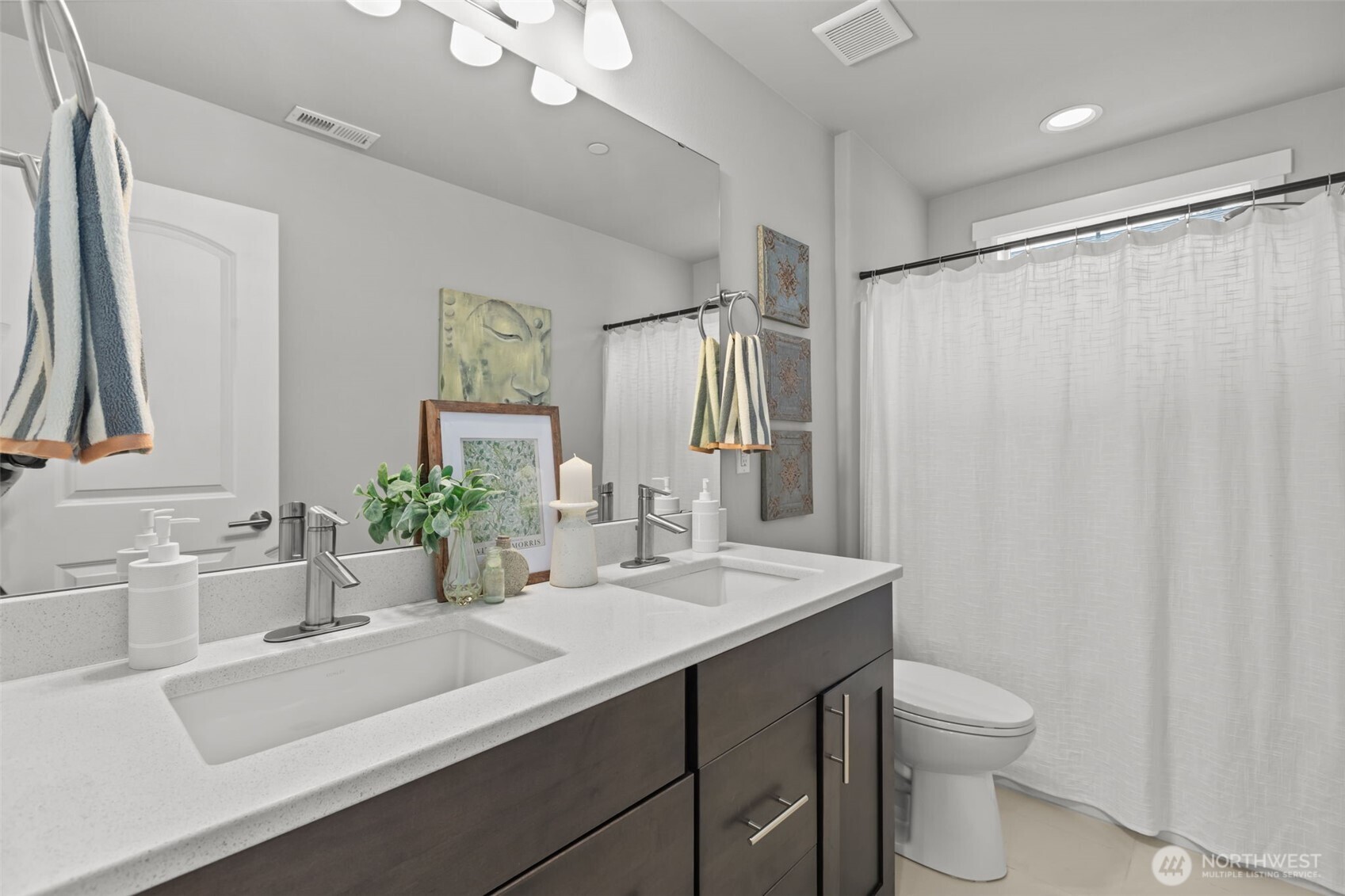 18231 3rd Drive Southeast Bothell, WA 98012 - Photo 24 of 40 a bathroom with a sink a toilet and a mirror