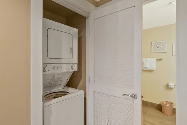 a bedroom with a bed and a night stand
