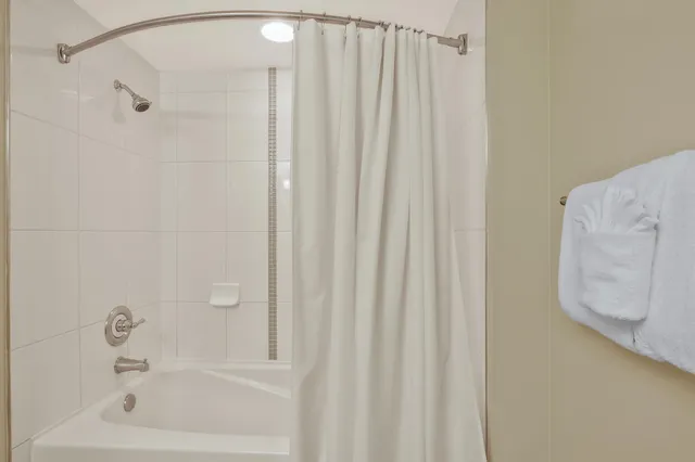 a view of a deck with chair and wooden floor