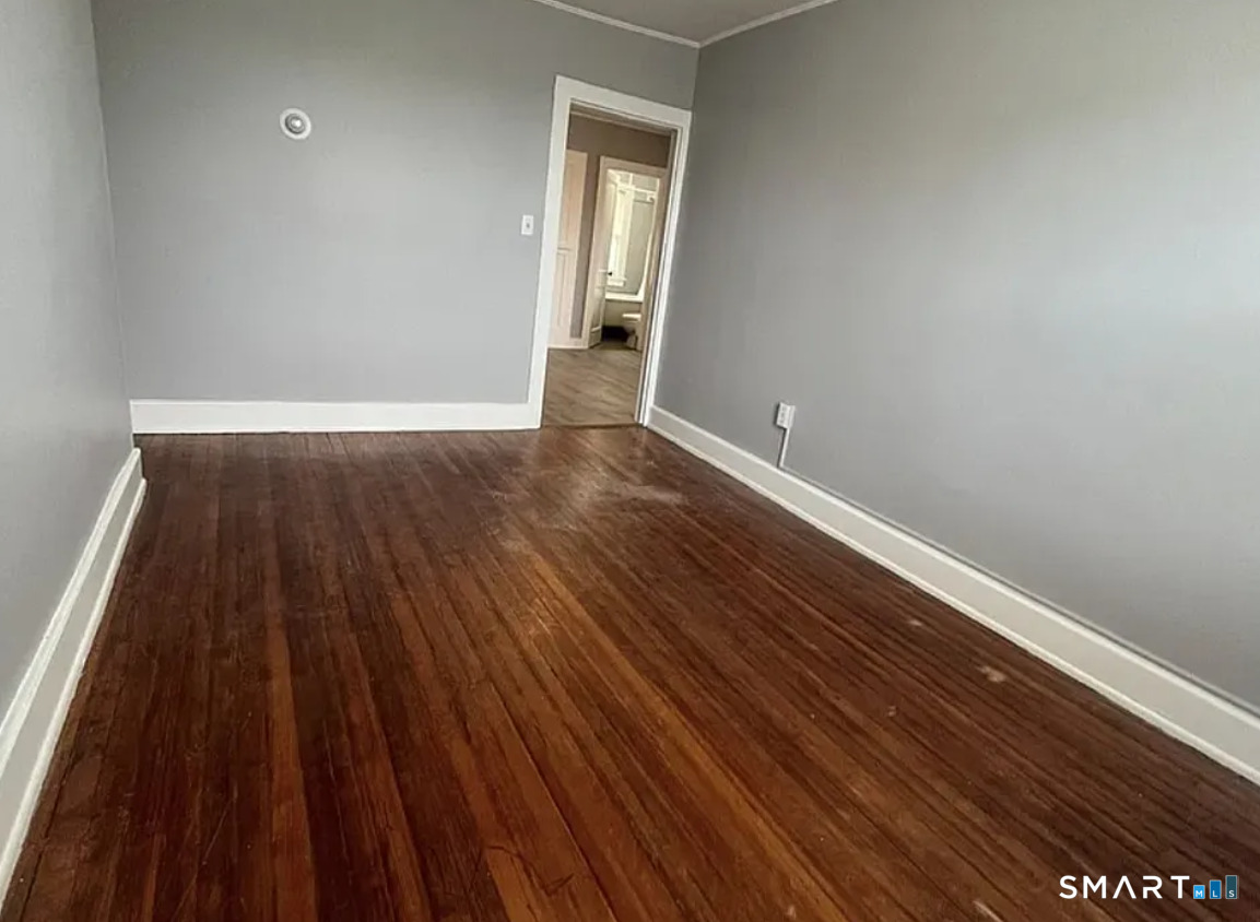 22 Green Street Middletown, CT 06457 - Photo 4 of 5 a view of a room with wooden floor and window